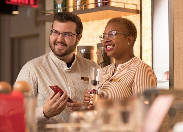 Nespresso sales associates reviewing products